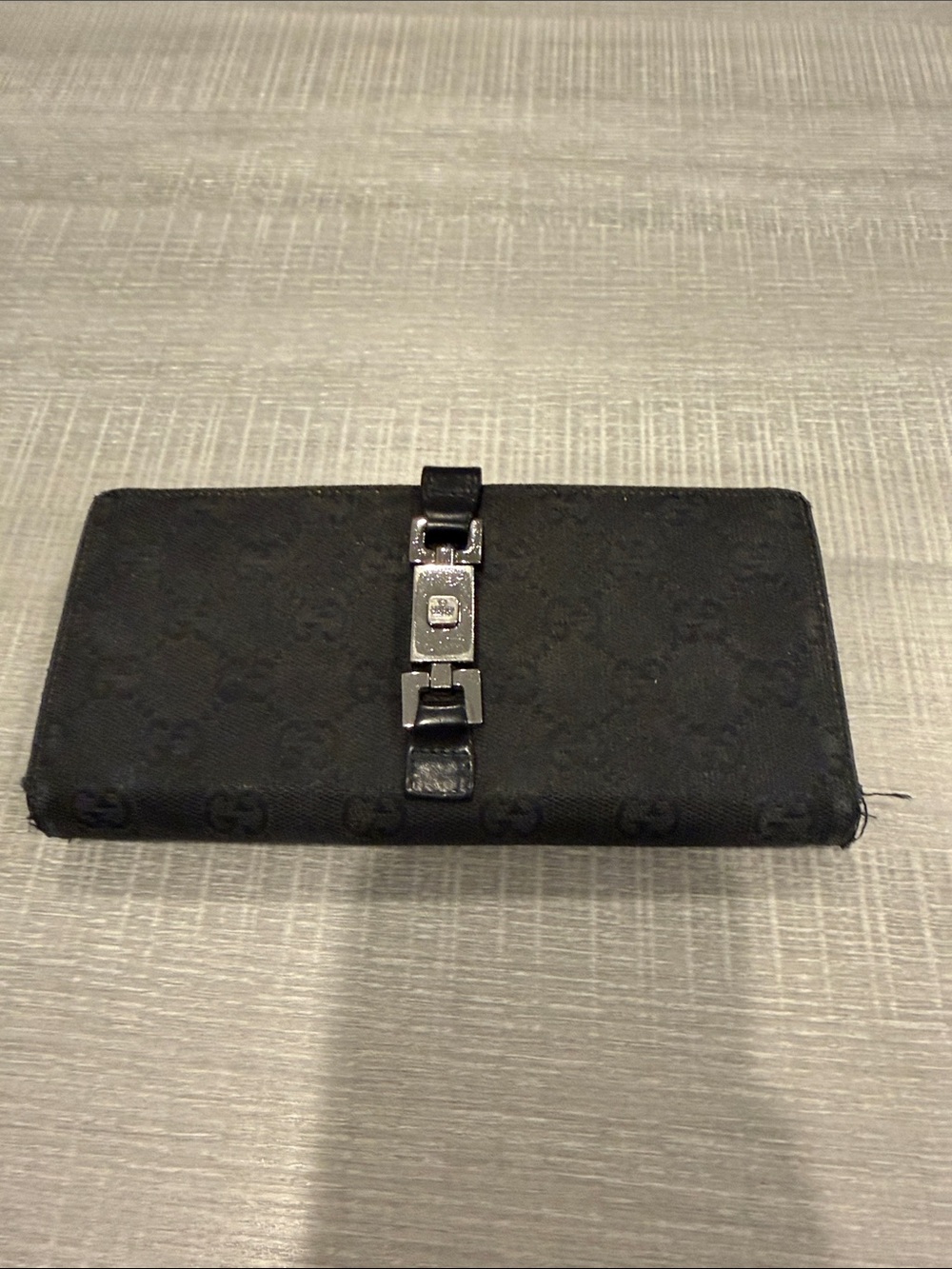 Authentic Gucci long continental wallet in black signature canvas.